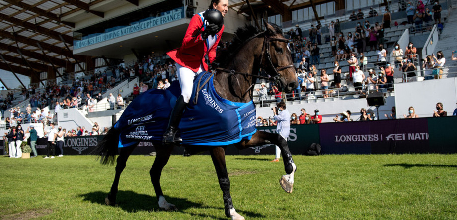 Martin Fuchs of Switzerland on Conner 70 celebrates victory in the FEI Jumping Nations Cup of France at La Baule, France, June 11, 2021.